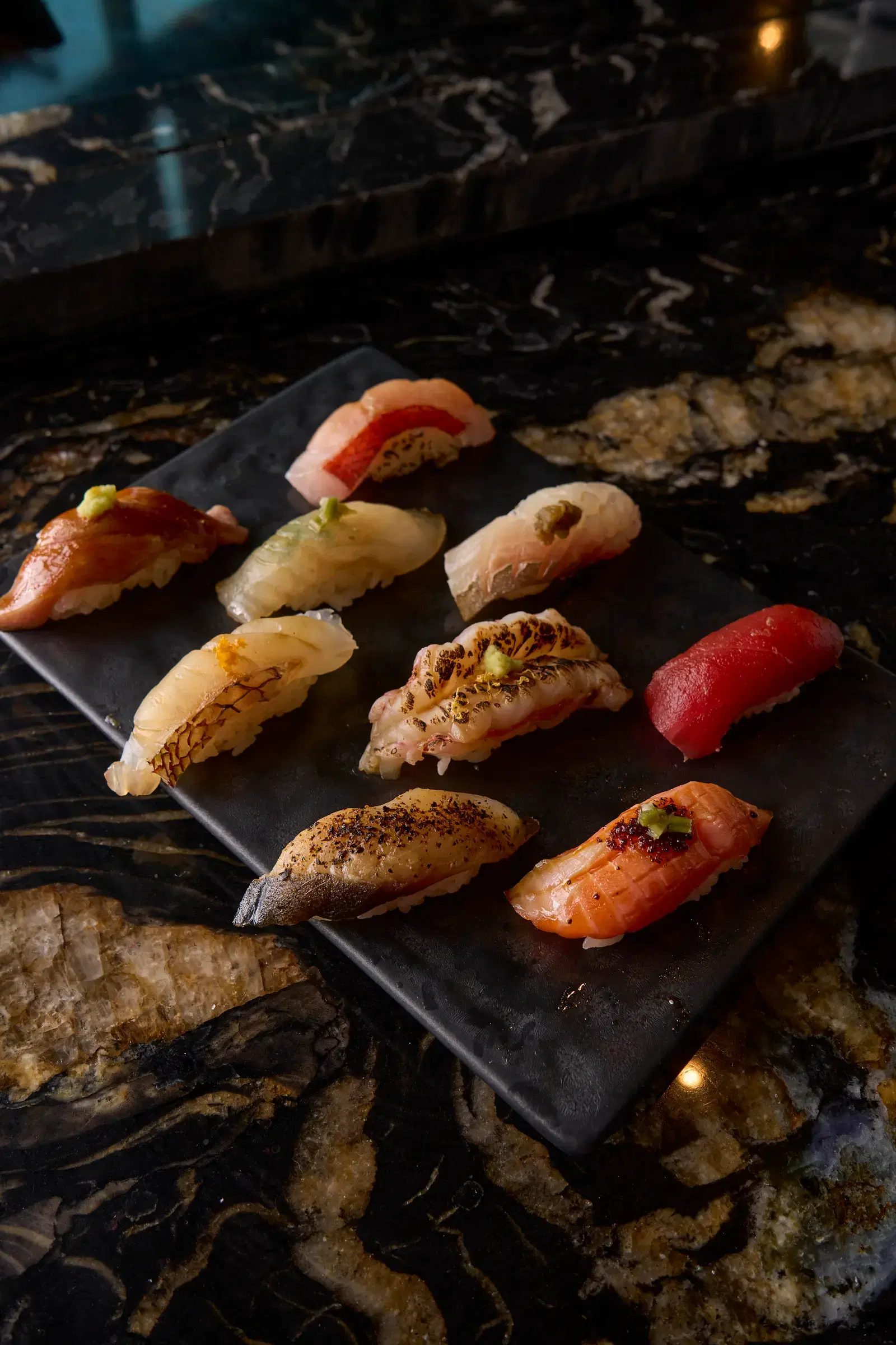 Trio of cocktails on a marble bar